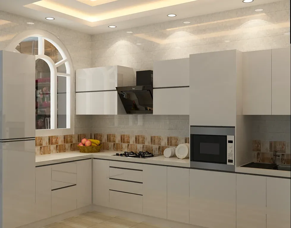 L-shaped white modular kitchen with a chimney hood, built-in microwave and an arched window