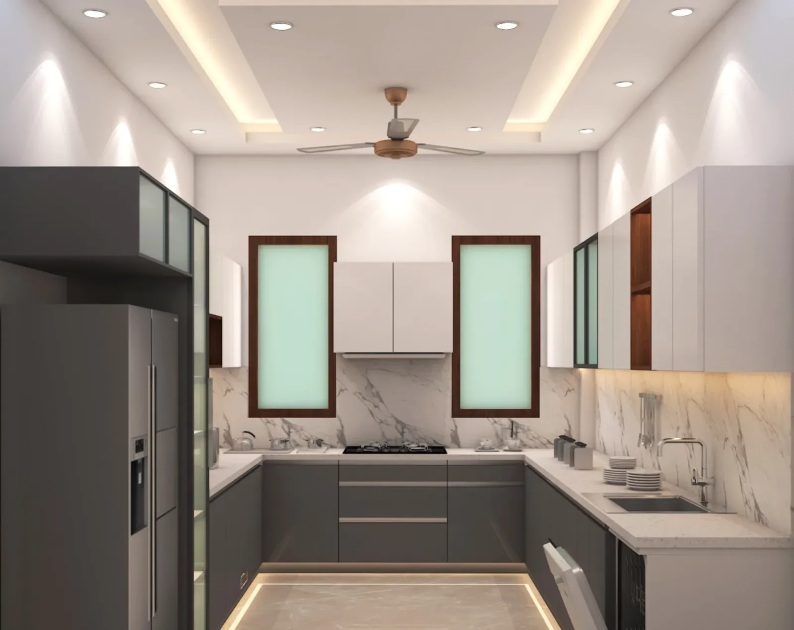 U-shaped modular kitchen with grey base units, white uppers, a marble backsplash and plinth lighting