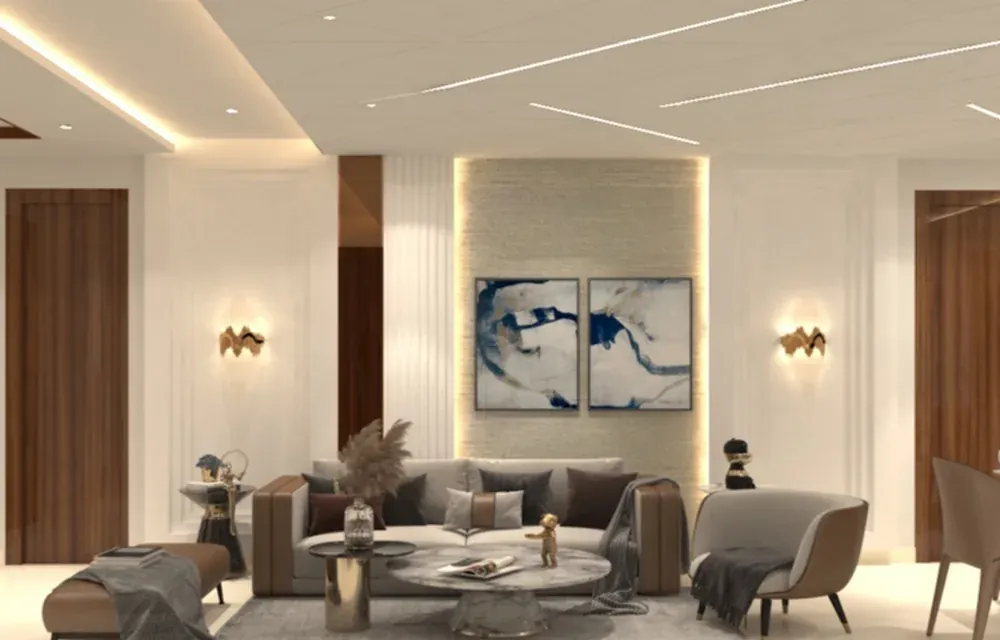 Living room with a grey sofa, round coffee tables, a backlit feature wall and paired artwork