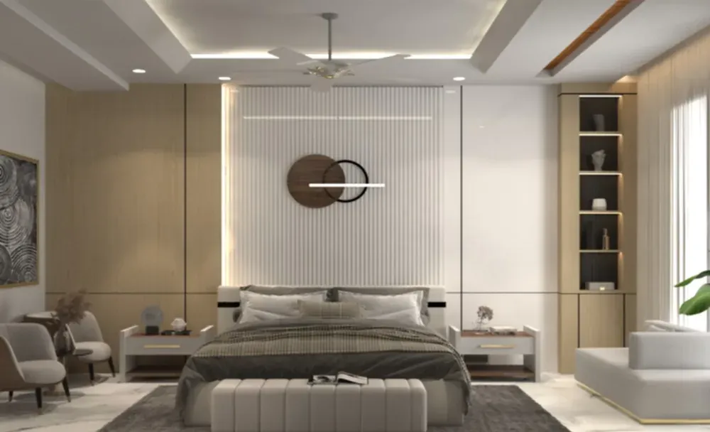 Master bedroom with a white fluted headboard wall, a circular art piece and a lounge chair