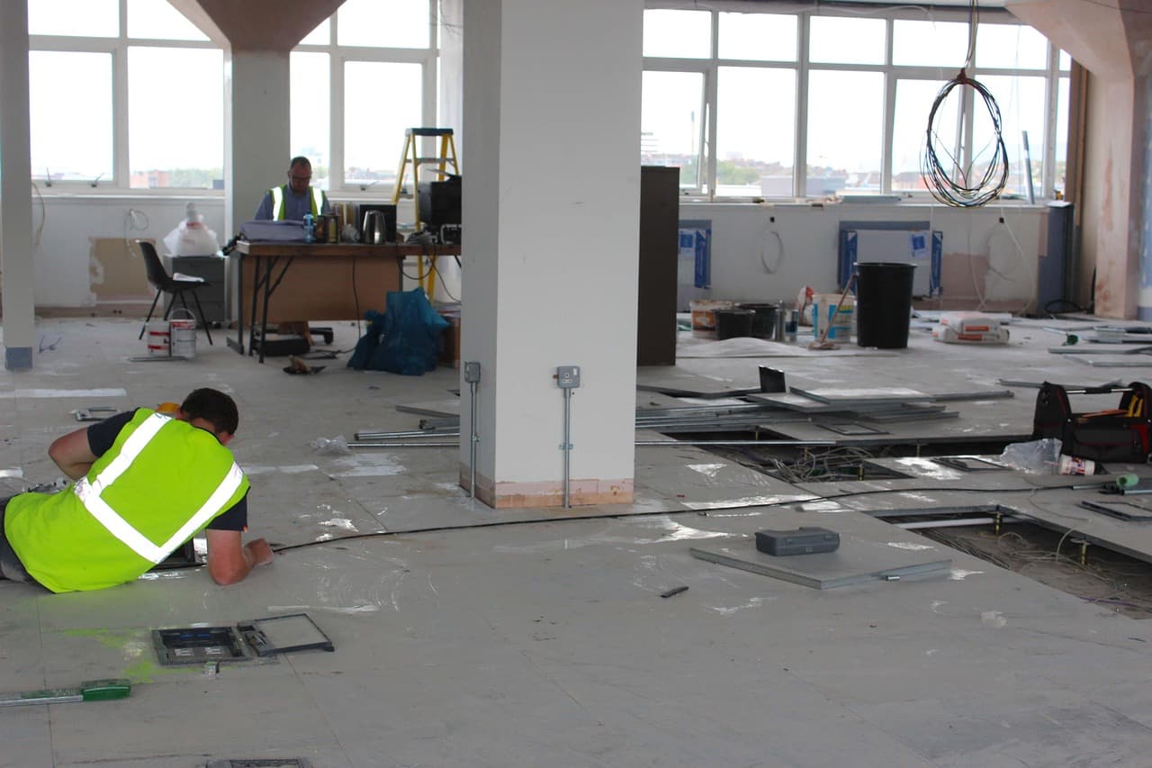 Electrical wiring and conduits installed during a residential building's rough-in construction phase