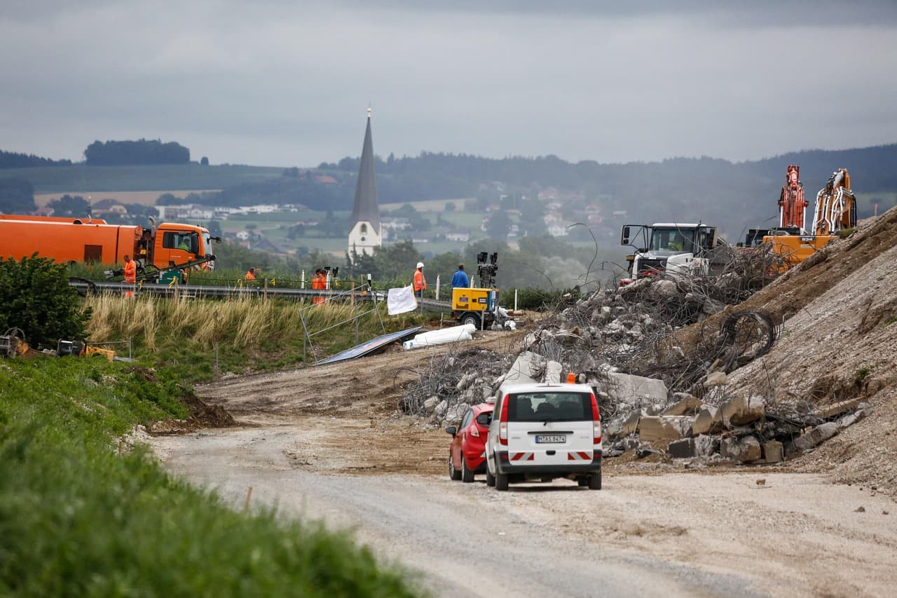 Heavy machinery excavating a trench for a house foundation at a construction site